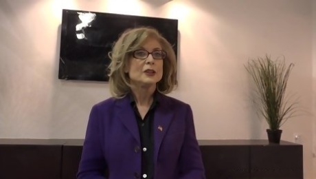 Nina Hartley knows how to handle two black dicks at the same time, in the conference room